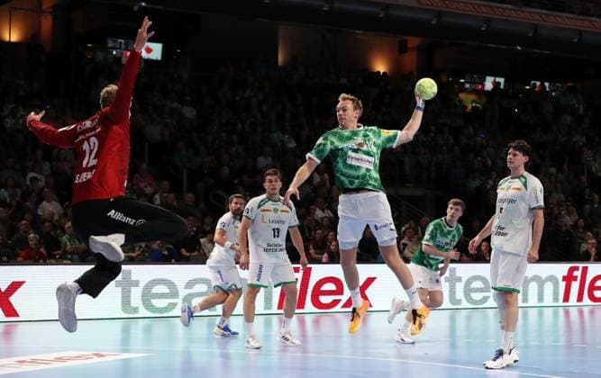 Mathias Gidsel scores a goal against goalkeeper Kristian Saeveras duel Game scene Action Sport Handball HBL Bundesliga Men 2 Matchday Season 2024 2025 15 09 2024 Füchse Berlin vs SC DHfK Leipzig
