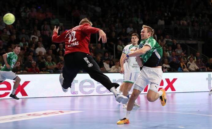 Mathias Gidsel scores a goal against goalkeeper Kristian Saeveras duel Game scene Action Sport Handball HBL Bundesliga Men 2 Matchday Season 2024 2025 15 09 2024 Füchse Berlin vs SC DHfK Leipzig