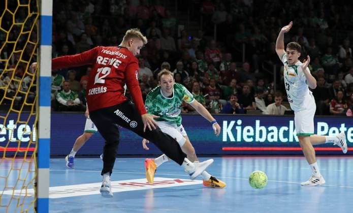 Mathias Gidsel scores a goal against goalkeeper Kristian Saeveras, right Matej Klima duel Game scene Action Sport Handball HBL Bundesliga Men 2 Matchday Season 2024 2025 15 09 2024 Füchse Berlin vs SC DHfK Leipzig