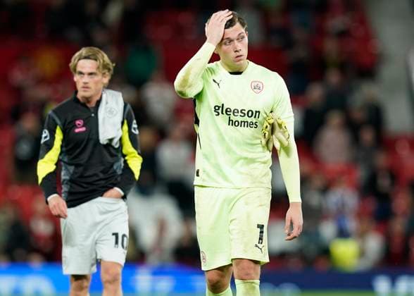 Manchester, England, 17th September 2024. A shellshocked Gabriel Slonina of Barnsley after letting in seven goals during the Carabao Cup match at Old Trafford, Manchester. Picture credit should read: Andrew Yates Sportimage EDITORIAL USE ONLY. No use with unauthorised audio, video, data, fixture lists, club league logos or live services. Online in-match use limited to 120 images, no video emulation. No use in betting, games or single club league player publications. SPI-3320-0082