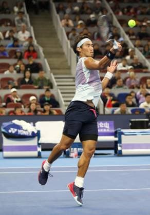 (241001) -- BEIJING, Oct. 1, 2024 -- Bu Yunchaokete of China hits a return during the men s singles semi-final match against Jannik Sinner of Italy at 2024 China Open tennis tournament in Beijing, capital of China, Oct. 1, 2024. (Photo by Xinhua) (SP)CHINA-BEIJING-TENNIS-CHINA OPEN-MEN S SINGLES (CN) DuxXinyi