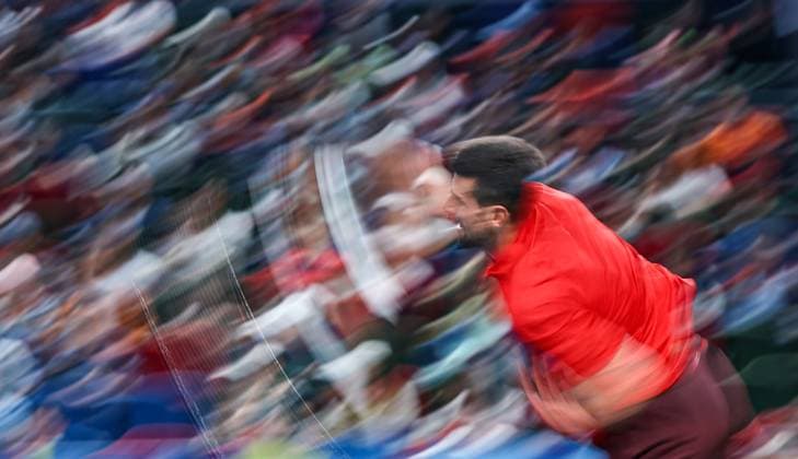(241013) -- BEIJING, Oct. 13, 2024 -- Novak Djokovic serves during the men s singles semifinal match between Taylor Fritz of the United States and Novak Djokovic of Serbia at the ATP, Tennis Herren World Tour Shanghai Masters tennis tournament in Shanghai, east China, Oct. 12, 2024. ) XINHUA PHOTOS OF THE DAY BaixXuefei