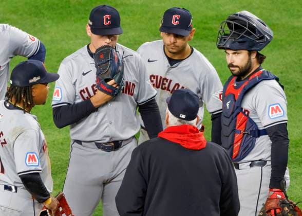 Cleveland Guardians pitcher Erik Sabrowski (C) receives a visit to the mound after giving up a run to the New York Yankees during the sixth inning of ALCS Game 2 at Yankee Stadium in New York, on Tuesday, October 15, 2024. NYP20241015321 JOHNxANGELILLO