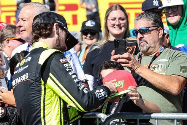 LAS VEGAS, NV - OCTOBER 20: Ryan Blaney ( 12 Team Penske Menards Great Stuff Ford) signs an autograph on the red carpet prior to the start of the South Point 400 NASCAR, Motorsport, USA Cup Series playoff race on October 20, 2024, at Las Vegas Motor Speedway in Las Vegas, NV. (Photo by Christopher Trim Icon Sportswire) AUTO: OCT 20 NASCAR Cup Series South Point 400 EDITORIAL USE ONLY Icon241020513