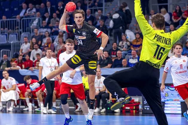 07 11 2024, Handball, EHF EURO Qualifiers, Germany Switzerland, SAP Arena Mannheim Rune Dahmke GER 34 against goalkeeper Nikola Portner SUI 16 Baden Württemberg Germany