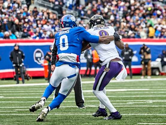 Baltimore Ravens quarterback Lamar Jackson (8) is sacked by New York Giants linebacker Brian Burns (0) during a NFL, American Football Herren, USA game at MetLife Stadium in East Rutherford, New Jersey. CSM East Rutherford United States - ZUMAc04_ 20241215_zma_c04_146 Copyright: xDuncanxWilliamsx