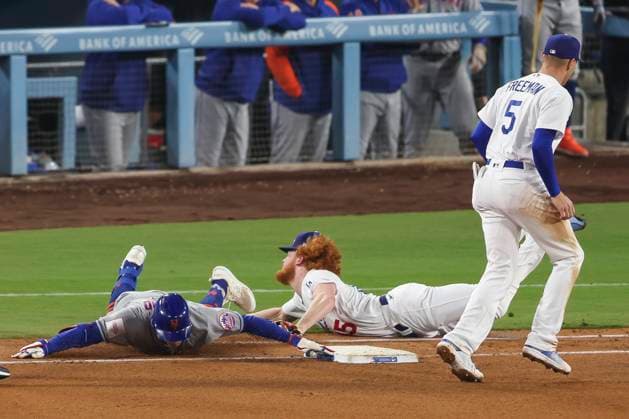 Los Angeles Dodgers starting pitcher Dustin May (85) attempts to tag New York Mets center fielder Brandon Nimmo (9) during a MLB, Baseball Herren, USA regular season game, Monday, April 18, 2023 in Los Angeles, CA. The Mets defeated the Dodgers 8-6. (Brandon Sloter Image of Los Angeles CA United States EDITORIAL USE ONLY Copyright: xImagexofxSportx BrandonxSloterx iosphotos294069