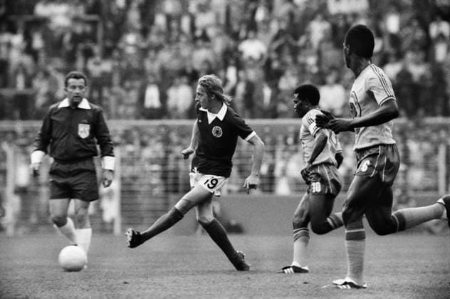 Football - 1974 World Cup - First Round, Group Two: Scotland 2 Zaire 0 Scotland s Denis Law plays a pass at Westfalenstadion, Dortmund, West Germany.