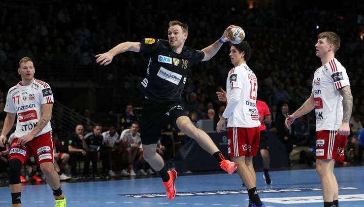 Mathias Gidsel scores a goal against goalkeeper Thorsten Fries duel Game scene Action Sport Handball CL Champions League Champions League Men Season 2024 2025 13 02 2025 Füchse Berlin vs Fredericia Handbold Klub in the Max Schmeling Halle