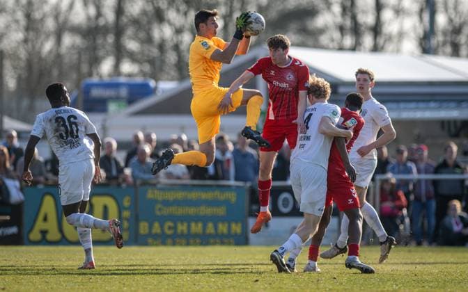 Soccer, Season 2024 2025, Regionalliga West, 08 03 2025, 25 Matchday, Men, 1 FC Bocholt white vs 1 FC Koeln U23 red v l Johannes Doerfler 1 FC Bocholt , Lucas Fox Goalkeeper 1 FC Bocholt , Bernie Lennemann 1 FC Koeln U23 , Kaspar Harbering 1 FC Bocholt , Mansour Ouro Tagba 1 FC Koeln U23 , Maik Amedick 1 FC Bocholt , Bocholt Stadion am Huenting Nordrhein Westfalen Germany 250308_fb_1fc-bocholt_1fc-koeln-u23_38908
