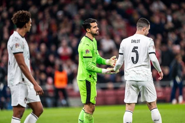 Denmark v Portugal, UEFA Nations League, Copenhagen, Denmark Copenhagen, Denmark. 20th, March 2025. Goalkeeper Diogo Costa (1) and Diogo Dalot (5) of Portugal seen during the UEFA Nations League play-off match between Denmark and Portugal at Parken in Copenhagen. Denmark, Copenhagen  Copyright: xGonzalesxPhoto FrederikkexJensenx