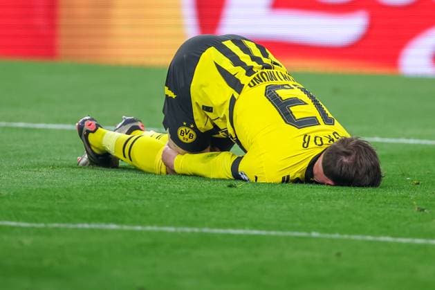 15 04 2025, Football, UEFA Champions League, Borussia Dortmund FC Barcelona, BVB Stadion, Quarter-final, Season 2024 2025 Pascal Groß BVB 13 lies in pain on the ground in the penalty area Penalty Regulations prohibit any use of photographs as image sequences and or quasi video Nordrhein Westfalen Germany