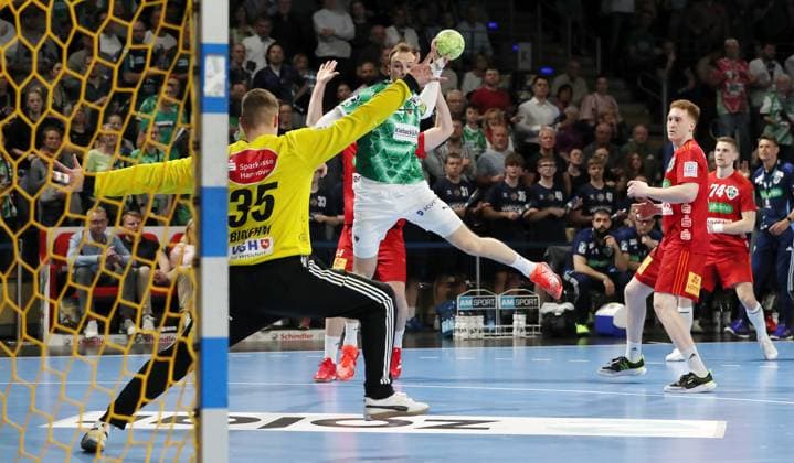 Mathias Gidsel scores a goal against goalkeeper Joel Birlehm duel Game scene Action Sport Handball HBL Bundesliga Men 26 Matchday Season 2024 2025 20 04 2025 Füchse Berlin vs TSV Hannover Burgdorf