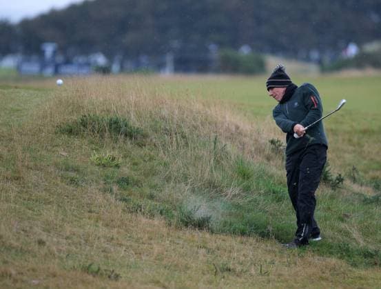 UK: The Alfred Dunhill Links Championship at Kingsbarns, St Andrews, Scotland on 30 September 2022 Pictured: Ex-footballer Gianfranco Zola plays out of rough on the 9th fairway at Kingsbarns during the second round of the Alfred Dunhill Links Championship 2022 St Andrews Fife Scotland Copyright: xAlexxToddx