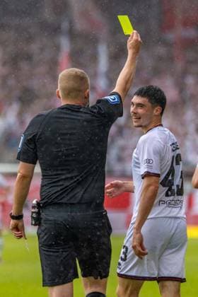 Cottbus, Germany 17 May 2025 3 Liga 2024 2025 FC Energie Cottbus vs FC Ingolstadt In the picture from left Timo Gansloweit shows Felix Keidel FCI the yellow card DFB regulations prohibit any use of photographs as image sequences and or quasi video LEAG Energie Stadion Brandenburg Copyright: xFotostandx xSchäferx