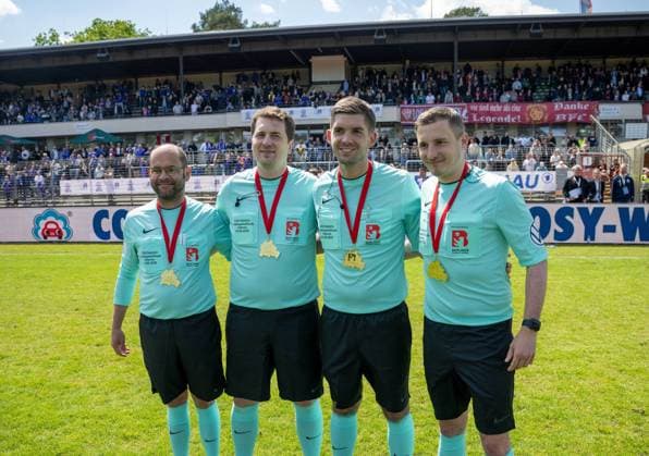 Soccer, Men, Season 2024 2025, COSY WASCH Berlin State Cup Final at Mommsenstadion, BSV Eintracht Mahlsdorf BFC Dynamo 0 2 , the referees at the award ceremony, from left the fourth official Rene Knopf, assistant Philipp Gentsch, referee Christoph Beblik, assistant Rene Wolfger, 24 05 2025, Copyright: xMatthiasxKochx