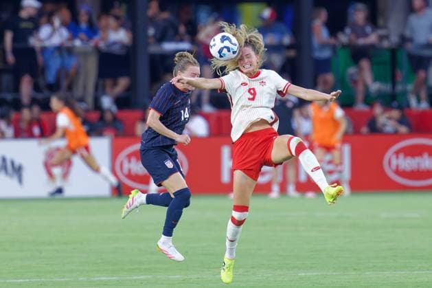 July 2, 2025, Washington, District of Columbia, USA: Jordyn Huitema 9 of Canada and Emily Sonnett 14 of the United States battle to head inbound ball during the US Woman™s national team, Nationalteam vs. Canada match at Audi Field. The USA won 3-0. Washington USA - ZUMA 20250702_mda_s363_154 Copyright: xJeffxScudderx