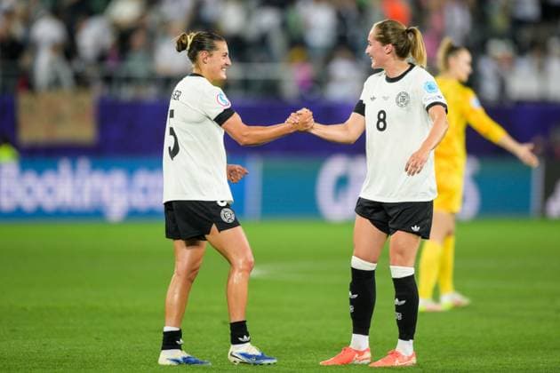 Soccer, UEFA Women s EURO 2025, 20250704, Germany Poland Pictured from l Carlotta WAMSER Germany, 5 , Sydney LOHMANN Germany, 8 Final cheer St Gallen Arena St Gallen Sankt Gallen Switzerland Copyright: Passion2Press MarkusxFischerx