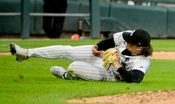 Chicago White Sox starting pitcher Davis Martin (65) dives for the ball before making the throw to first for the on Philadelphia Phillies Nick Castellanos (8) during the fifth inning at Rate Field in Chicago, IL on Monday, July 28, 2025.  CHI20250728115 MARKxBLACK