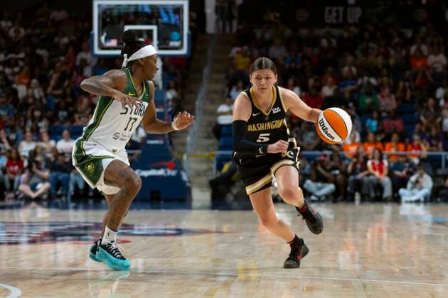 July 26, 2025, Washington, District Of Columbia, USA: JADE MELBOURNE 5 of the Washington Mystics handles the ball against ERICA WHEELER 17 of the Seattle Storm at CareFirst Arena Washington USA - ZUMAs352 20250726_zsp_s352_016 Copyright: xSabinaxShyshx