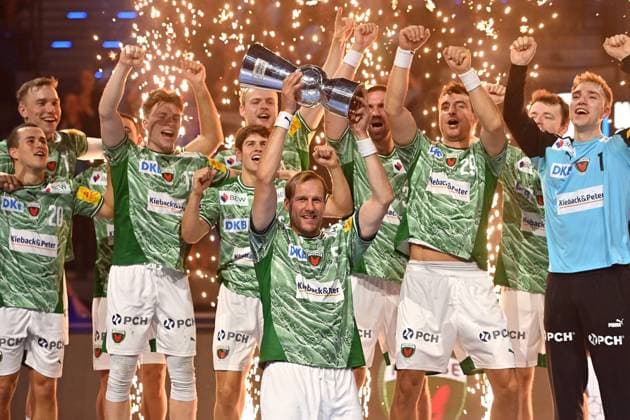 Award ceremony,team photo,team,team,team photo,Max DAJ Fuechse Berlin with trophy,cup,trophy cheers,joy,enthusiasm, Handball Super Cup 2025 of the men Fuechse Berlin vs THW Kiel on 23 08 2025, SAP GARDEN Munich