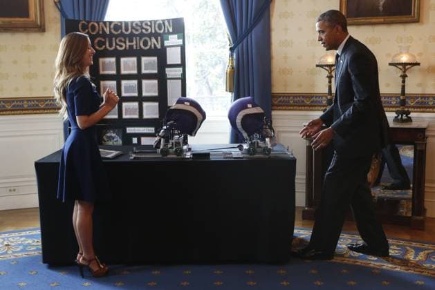 May 27, 2014 - Washington, District Of Columbia, U.S - United States President Barack Obama looks at the Concussion cushion football helmet project from Maria Hanes, Santa Cruz, California, during the 2014 White House Science Fair at the White House, Washington DC, Tuesday May 27, 2014. The Fair celebrates the winners of STEM (science, technology, engineering and math) competitions across the country. Copyright: xAudexGuerrucci Pool Cnpx