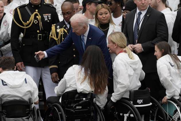 May 4, 2022, Washington, DC, United States: President Joe Biden takes a selfie with members of Team USA during a welcoming ceremony of Team USA to White House at South Lawn White House in Washington DC, USA. Copyright: xLeninxNollyx