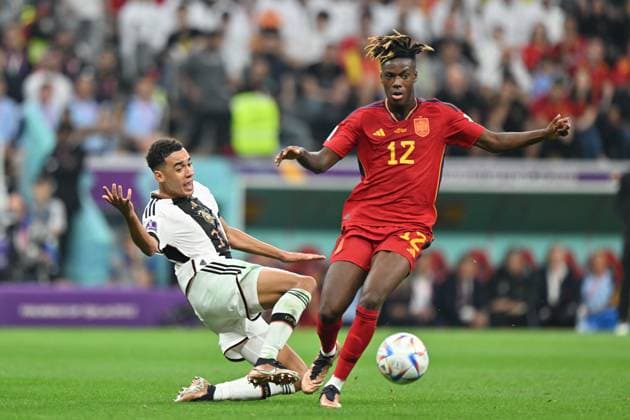 Spain v Germany: FIFA World Cup, WM, Weltmeisterschaft, Fussball 2022 AL KHOR, QATAR - NOVEMBER 27: Jamal Musiala (L) of Germany in action against Nico Williams 12 of Spain during the FIFA World Cup Qatar 2022 Group E match between Spain and Germany at Al Bayt Stadium on November 27, 2022 in Al Khor, Qatar. Al Khawr Qatar. Editorial use only. Please get in touch for any other usage.  Copyright: x2025xAnadoluxMustafaxYalcÄ±nx