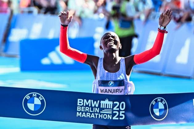 21 09 2025, xlakx, Athletics Marathon 2025, in Berlin v l Finish line Winner of the Womens Berlin Marathon Rosemary Wanjiru Berlin Daniel Lakomski