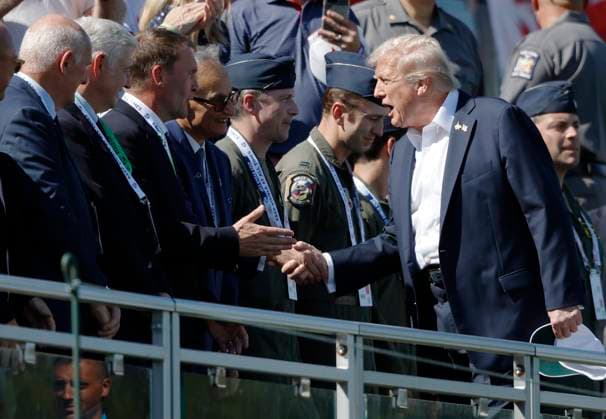 President Donald Trump shakes hands with attendees as he arrives for the opening day of the 45th Ryder Cup at The Black Course at Bethpage State Park in Farmingdale, New York on Friday, September 26, 2025. RYD20250926807 JOHNxANGELILLO