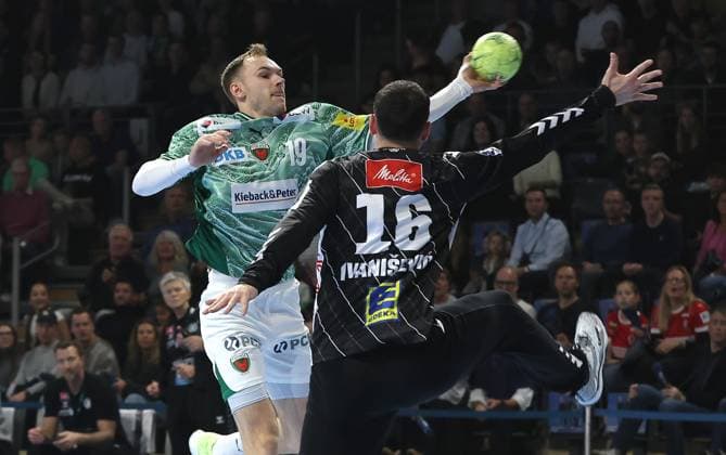 Mathias Gidsel scores a goal against goalkeeper Tibor Ivanisevic duel Game scene Action Sport Handball HBL Bundesliga Men 8 Matchday Season 2025 2026 12 10 2025 Füchse Berlin vs TSV GWD Minden