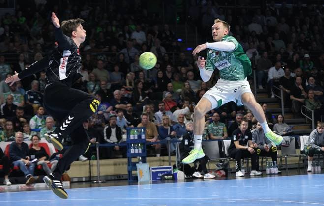 Mathias Gidsel scores a goal against goalkeeper Malte Semisch duel Game scene Action Sport Handball HBL Bundesliga Men 8 Matchday Season 2025 2026 12 10 2025 Füchse Berlin vs TSV GWD Minden