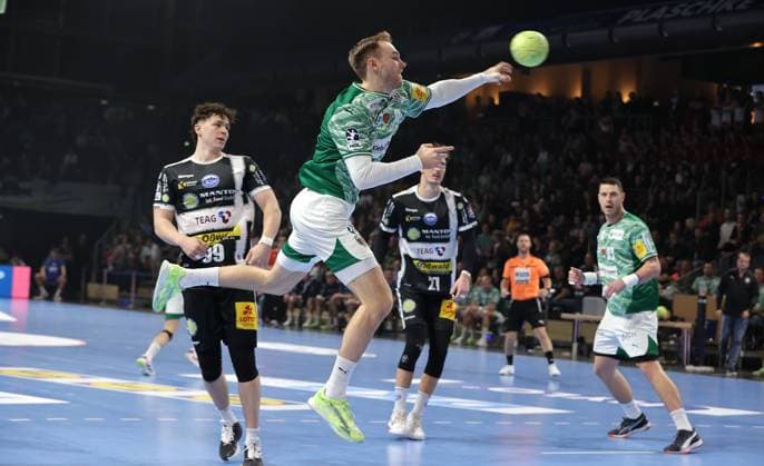 Mathias Gidsel scores a goal against goalkeeper Silvio Heinevetter Sport Handball DHB Pokal Round of 16 Men Season 2025 2026 06 11 2025 Füchse Berlin vs ThSV Eisenach