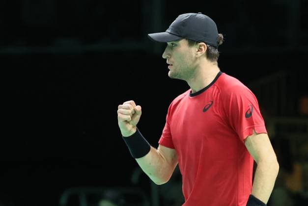 Belgian Raphael Collignon reacts during a tennis match against Italian Berrettini, the first in the Davis Cup semifinals between Belgium and Italy, in Bologna, Italy, on Friday 21 November 2025. The Davis Cup top eight Finals take place in Bologna from November 18 to 23. BENOITxDOPPAGNE  x143249069x