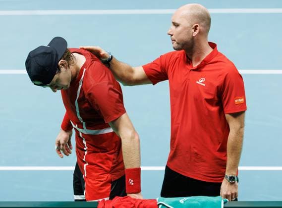 Belgian Zizou Bergs and Belgian captain Steve Darcis look dejected after a tennis match between Belgian Bergs and Italian Cobolli, the second in the Davis Cup semifinals between Belgium and Italy, in Bologna, Italy, on Friday 21 November 2025. The Davis Cup top eight Finals take place in Bologna from November 18 to 23. BENOITxDOPPAGNE  x143304946x
