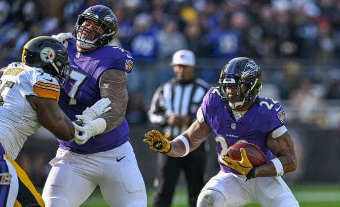 Baltimore Ravens running back Derrick Henry (22) scrambles for short yardage against the Pittsburgh Steelers during the first quarter at M&T Bank Stadium in Baltimore, Maryland, on Sunday, December 7 2025. BAL20251207118 DAVIDxTULIS
