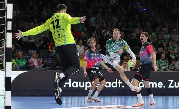Mathias Gidsel scores a goal against goalkeeper Anadin Suljakovic duel Game scene Action Sport Handball HBL Bundesliga Men 17 Matchday Season 2025 2026 14 12 2025 Füchse Berlin vs HSG Wetzlar