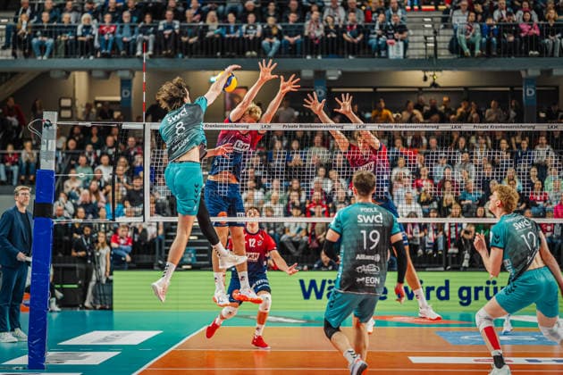 Volleyball mens season 2025 2026 Zoi DVV Cup semi-final SVG Lüneburg vs SWD powervolleys Düren 16 12 2025 Robin Baghdaday 8 SWD powervolleys Düren against the block of Axel Enlund 17 SVG Lüneburg and Joscha Kunstmann 7 SVG Lüneburg