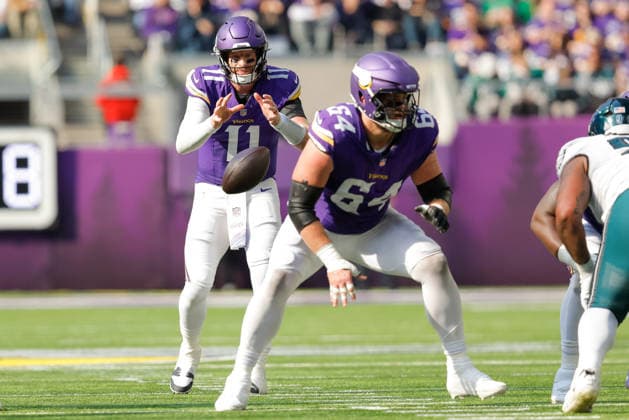MINNEAPOLIS, MN - OCTOBER 19: Minnesota Vikings quarterback Carson Wentz (11) takes a snap from guard Blake Brandel (64) during the second half of NFL, American Football Herren, USA game between the Minnesota Vikings and Philadelphia Eagles on October 19th, 2025, at U.S. Bank Stadium in Minneapolis, MN. (Photo by Bailey Hillesheim Icon Sportswire) NFL: OCT 19 Eagles at Vikings EDITORIAL USE ONLY Icon251019253