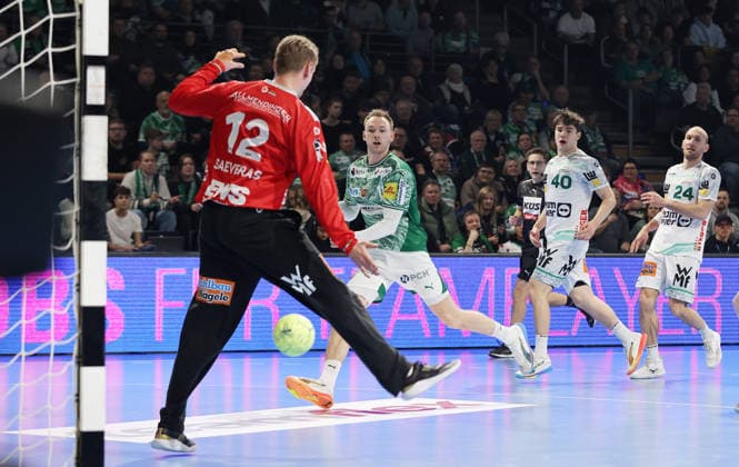 Mathias Gidsel scores a goal against goalkeeper Kristian Saeveras duel Game scene Action Sport Handball HBL Bundesliga Men 19 Matchday Season 2025 2026 27 12 2025 Füchse Berlin vs Frisch Auf Göppingen