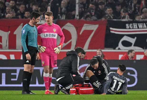Younes Ebnoutalib Eintracht Frankfurt SGE 11 injured Injury Supervisor Referee Referee Dr Matthias Joellenbeck Supervisor Goalkeeper Alexander Nuebel VfB Stuttgart 33 VfB Stuttgart vs Eintracht Frankfurt SGE 13 01 2026 DFL REGULATIONS PROHIBIT ANY USE OF PHOTOGRAPHS AS IMAGE SEQUENCES AND OR QUASI VIDEO VfB Stuttgart vs Eintracht Frankfurt SGE