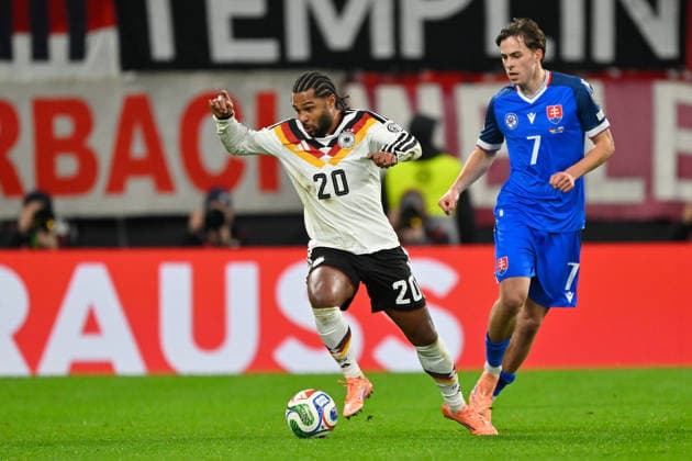 Leipzig, Red Bull Arena, 17 11 25, GER, Men, Qualification World Cup 2026, Germany Slovakia Picture from left in duel Serge GNABRY Germany and Leo SAUER Slovakia UEFA regulations prohibit any use of photographs as image sequences and or quasi video Saxony Germany