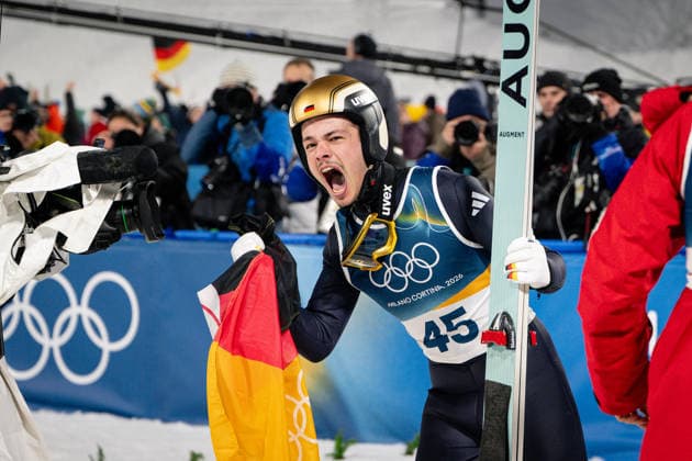 Philipp Raimund Germany celebrating his Gold Medal, Ski Jumping Men Normal Hill Milano Cortina 2026 Olympic Games 09 02 2026 Copyright: HMBxMedia MarcxNiemeyer