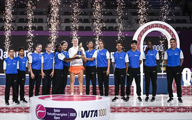 Qatar TotalEnergies Open 2026 Final, victory ceremony, winner Karolina Muchova CZE with ball kids Karolina Muchova CZE