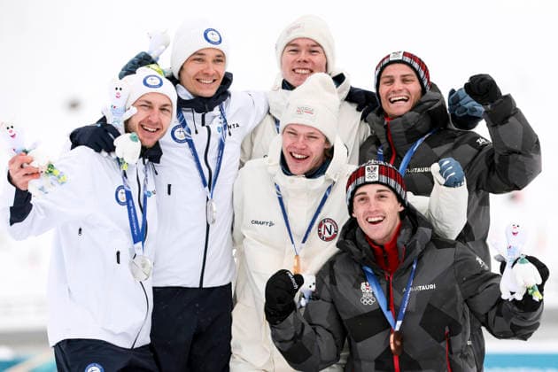 OLYMPICS - Winter Olympic Games, Olympische Spiele, Olympia, OS Milano Cortina 2026 TESERO,ITALY,19.FEB.26 - OLYMPICS, NORDIC SKIING, NORDIC COMBINED - Winter Olympic Games Milano Cortina 2026, team sprint, medal ceremony. Image shows the rejoicing of Ilkka Herola and Eero Hirvonen (FIN), Andreas Skoglund and Jens Luraas Oftebro (NOR), Stefan Rettenegger and Johannes Lamparter (AUT). Keywords: medal, mascot. GEPAxpictures xMatthiasxTrinkl