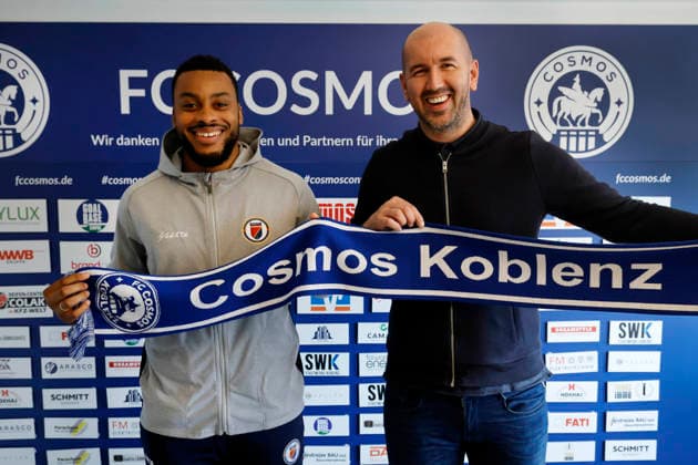 Weißenthurm, Germany, 10 03 2026 FC Cosmos Koblenz The goalkeeper Josue DUVERGER FC Cosmos Koblenz left with the managing director of FC Cosmos Admir SOFTIC right in front of the sponsor wall in the offices of FC Cosmos Koblenz in Weißenthurm The goalkeeper of the Oberliga club is also the goalkeeper of the national soccer team of Haiti and will represent his country at the FIFA World Cup in the USA Admir Softic is a former professional soccer player