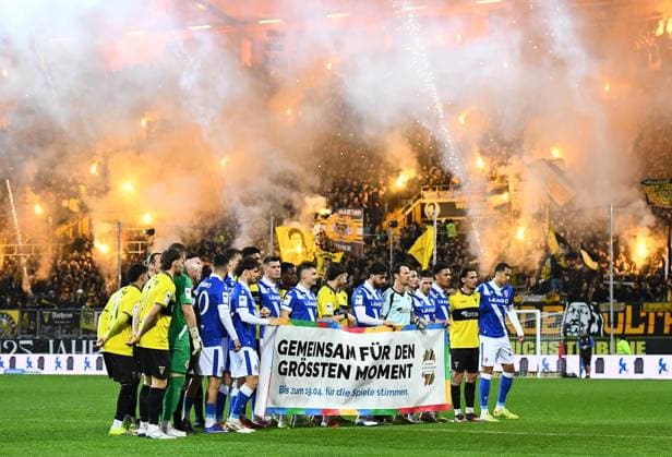 Soccer Men 3 LiagSeason 2025 2026 29 Matchday Alemannia Aachen Energie Cottbus on 13 03 2026 at Tivoli Stadium in Aachen The players hold up a banner North Rhine-Westphalia Germany
