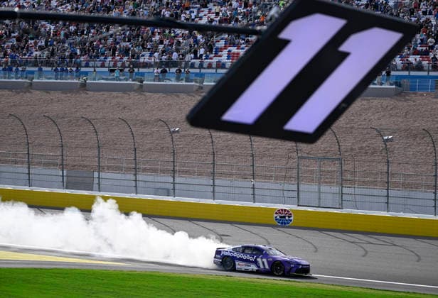 LAS VEGAS, NV - MARCH 15: Denny Hamlin ( 11 Joe Gibbs Racing Yahoo! Toyota) celebrates with a burnout down the front straight after winning the NASCAR, Motorsport, USA Cup Series Pennzoil 400 on March 15, 2026, at Las Vegas Motor Speedway in Las Vegas, NV. (Photo by Will Lester Icon Sportswire) AUTO: MAR 15 NASCAR Cup Series Pennzoil 400 EDITORIAL USE ONLY Icon24031515441