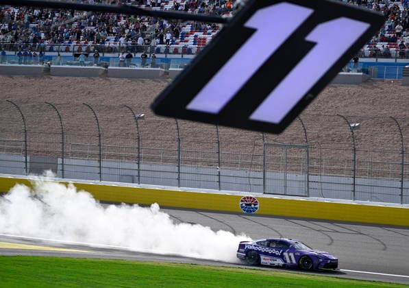 LAS VEGAS, NV - MARCH 15: Denny Hamlin ( 11 Joe Gibbs Racing Yahoo! Toyota) celebrates with a burnout down the front straight after winning the NASCAR, Motorsport, USA Cup Series Pennzoil 400 on March 15, 2026, at Las Vegas Motor Speedway in Las Vegas, NV. (Photo by Will Lester Icon Sportswire) AUTO: MAR 15 NASCAR Cup Series Pennzoil 400 EDITORIAL USE ONLY Icon24031515450