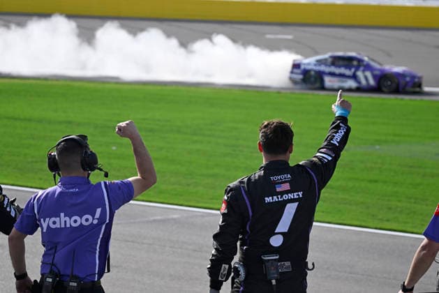 LAS VEGAS, NV - MARCH 15: Denny Hamlin ( 11 Joe Gibbs Racing Yahoo! Toyota) celebrates with a burnout down the front straight as his crew reacts after winning the NASCAR, Motorsport, USA Cup Series Pennzoil 400 on March 15, 2026, at Las Vegas Motor Speedway in Las Vegas, NV. (Photo by Will Lester Icon Sportswire) AUTO: MAR 15 NASCAR Cup Series Pennzoil 400 EDITORIAL USE ONLY Icon24031515480